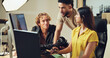 © BuyOutFelix01/peopleimages.com - People, computer and teamwork for photography in studio for production results, talking and review. Staff, producer and group to check for fashion photographer, magazine catalog and filming process