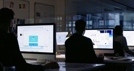 Poster - Team, computer and business people at night for coworking, feedback and planning in website design. Developer, back and screen with overtime brainstorming for webpage, idea and project management