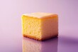 © AlparadiseDesign - A single square piece of yellow cake with white icing