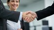 © Qbertstudio - Caucasian businesswoman and businessman shaking hands in modern office Professional interaction highlighting teamwork