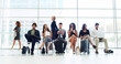 © peopleimages.com - Business, people and waiting line at airport of travel delay, corporate trip and international flight. Staff, row and process with luggage of boarding schedule, online booking and ticket application
