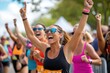 © MastersedZ - joyful woman celebrates finishing marathon outdoors