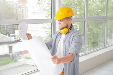 Wall Mural - male contractor with house plan near window in room