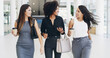 © peopleimages.com - Business women, walking and friends in office for creative conversation, coffee and networking with phone. Happy workers, team and together in lobby with drink, collaboration or planning on break
