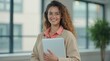 © K1drock - Close-up of woman with laptop in sleek office, soft window light, pastel attire, modern calm creative focus