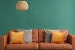 © Pixel-Shot - Cozy sofa with cushions and hanging lamp on green background