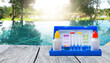 © sirirak - Water tester test kit on wooden table over blurred resort swimming pool background, swimming pool service and maintenance