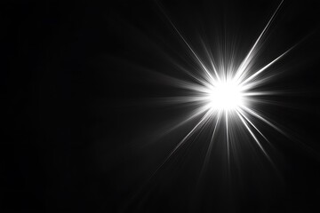Wall Mural - bright starburst light effect on black background.