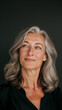 © HAOWEI - Portrait of a Mature Woman with Gray Hair Looking Upwards, Against a Dark Background