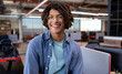 © Wavebreak Media - Smiling young man in modern office, enjoying creative work environment, copy space