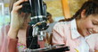 © vectorfusionart - In school, students using microscope and laughing, enjoying science class activities