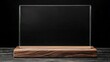 © leymart - Clear glass plaque on wooden base, isolated on black background.