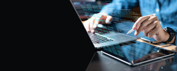 .Professional working with digital tablet and writing computer code language.For creative work such as graphic design, digital illustration, or modern workspace.