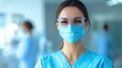 © Nat_Photo_AI - Smiling Healthcare Worker in Blue Scrubs and Protective Gear at Medical Facility During Daytime