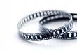 © warunthorn - Close-Up of Vintage Film Strip on White Background for Creative Projects