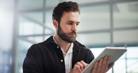 Fototapete - Scroll, creative and business man with tablet in office for networking or social media marketer online. Technology, startup and serious worker reading email, campaign and brand promotion on platform