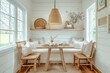 © JIALU - Coastal-style kitchen dining area with small table, chairs, wooden lamp, and natural light from the window.