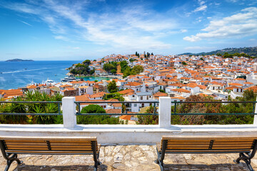 Wall Mural - elevated, panoramic view over the town of skiathos island, greece, during a sunny summer day from a 