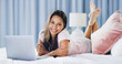 © peopleimages.com - Relax, portrait and laptop with woman in bedroom for online dating, chat forum and social media. Profile view, status update and connection for person at home for networking, communication and search