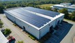 © Viktor - Aerial view of solar panel installation on commercial building roof. Renewable energy concept, eco-friendly technology. Solar panels for electricity generation, sustainable power.