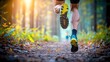 © tuiphotoengineer - Energetic trail runner moving through a picturesque autumn landscape with sun dappled forest fallen leaves and a winding dirt pathway