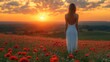 © Zikie_ - A woman stands in a field looking toward the beautiful sunset