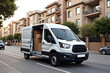 © ANASTASIIA - White delivery van with open doors and cardboard boxes on urban street