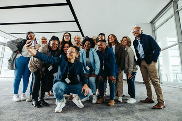Wall Mural - corporate team group photo in modern office, collaborating and smiling together