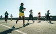 © Jacob Lund - Diverse group of women participating in a running race outdoors