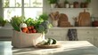 © Makhbuba - A reusable shopping bag filled with fresh vegetables on a light kitchen counter pic