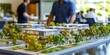 © Nats - A commercial developer showcases a scale model of a new office complex.