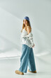 © LIGHTFIELD STUDIOS - Stylish young woman brightens the studio with vibrant spring outfit and joyful spirit
