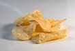 © Tetra Images - Studio shot of stack of potato chips on white background