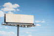 © Tetra Images - White blank billboard against sky