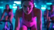 © 99 RIC - Intense Female Cyclist Training in Neon-Lit Studio with Focused Expression