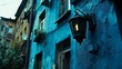 © Nusantara - Eerie Streetlight Casting a Glow on an Old Blue Building Facade at Dusk