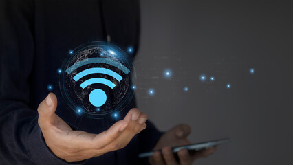 Wall Mural - use business smartphone with wifi icon, business communication social network concept.