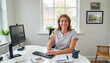 © Khelga Volkova - Smiling woman giving thumbs up in modern office