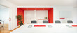 © ADDICTIVE STOCK - Modern office meeting room with bold red accents