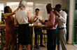 © Wavebreak Media - Celebrating at wedding reception, friends toasting drinks and sharing joyful moments