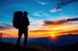 © Milosava - Hiker watching colorful sunset in mountains