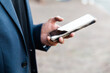 © ADDICTIVE STOCK - Indian man checking smartphone at a conference of AI in Amsterdam