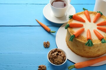 Wall Mural - delicious homemade carrot cake served on light blue wooden table. space for text