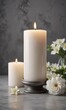© Sayfar - Grey background with white soy candle centerpiece, scented, relaxation, simple elegance