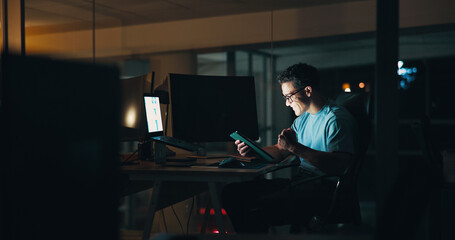 Leinwandbilder - Business, man and celebration with tablet at night for website security success, troubleshooting or UI design. Web developer, laptop or victory fist for app launch or system update deadline in office