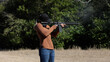 © Cana - Woman Shooting Rifle