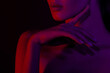 © Mirrorstudio - Female silhouette in red and purple light, artistic close-up