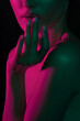 © Mirrorstudio - Dramatic portrait of young asian female in pink and green lighting