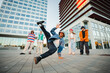 © Jose Calsina - Energetic young people showcasing incredible breakdancing skills in urban environment with friends demonstrating passion for hip-hop culture and dance moves in group performance full of enthusiasm