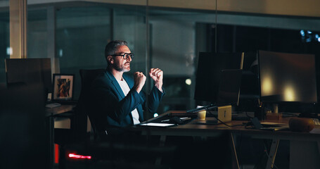 Poster - Business, man and celebration with laptop at night for software development or troubleshooting success. Web developer, mature person and victory fist for website maintenance or system update deadline